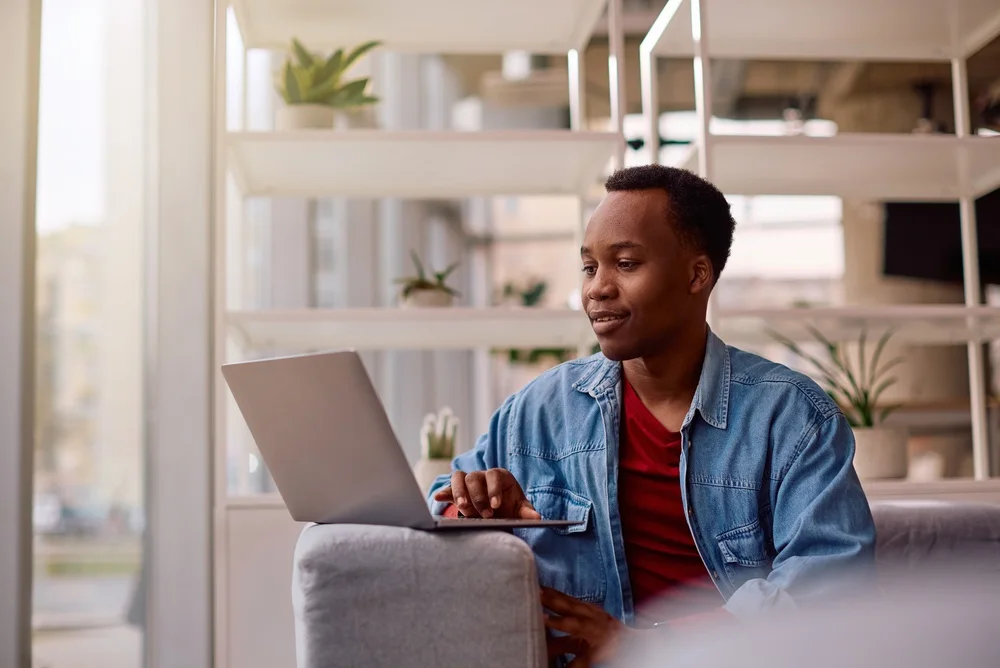 Student studying on a laptop at home