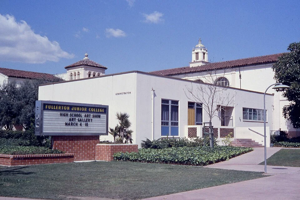 The white Fullerton College building with its marquee sign and bell tower