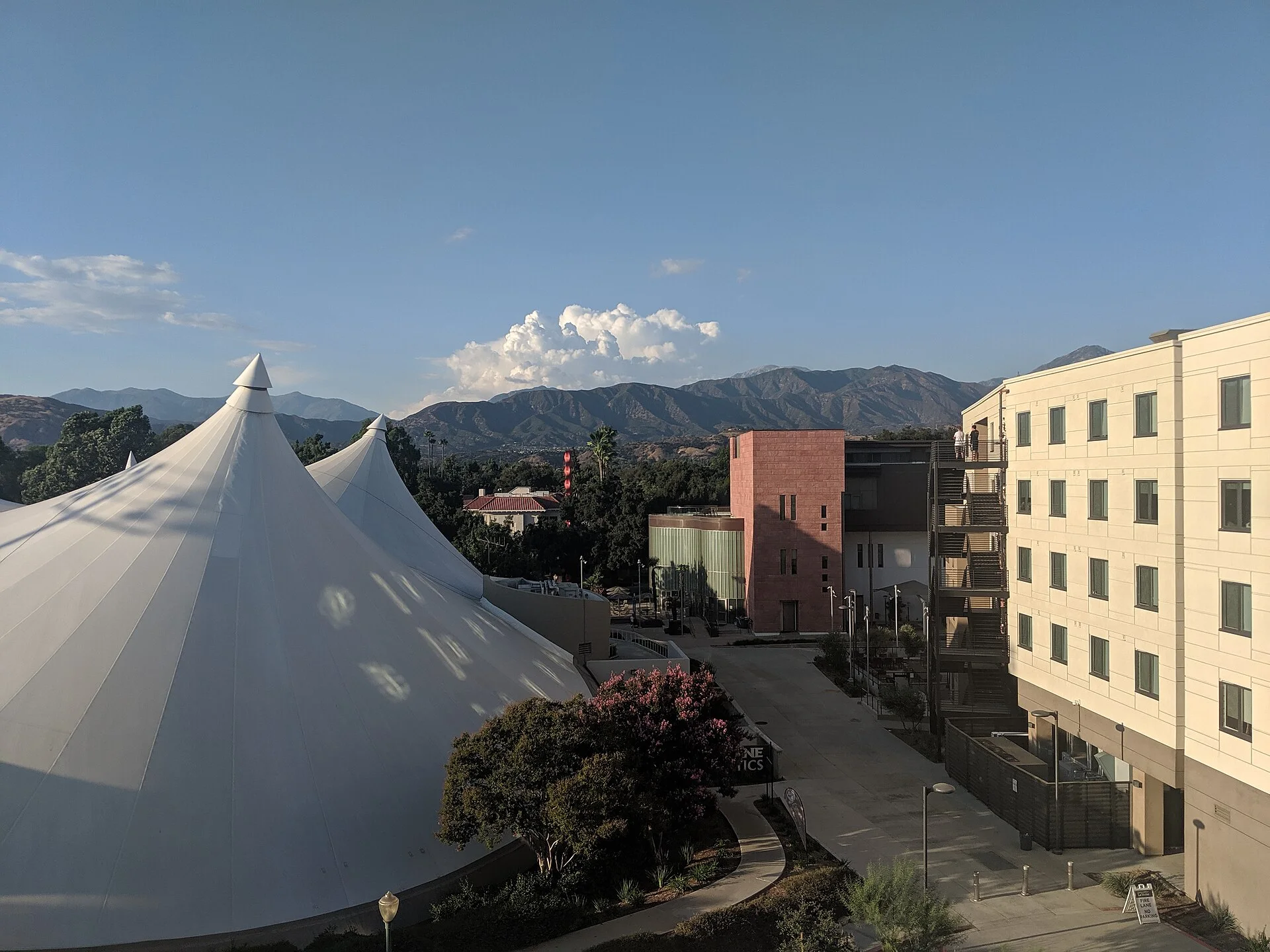 The white tent structures of the University of La Verne campus with mountains behind